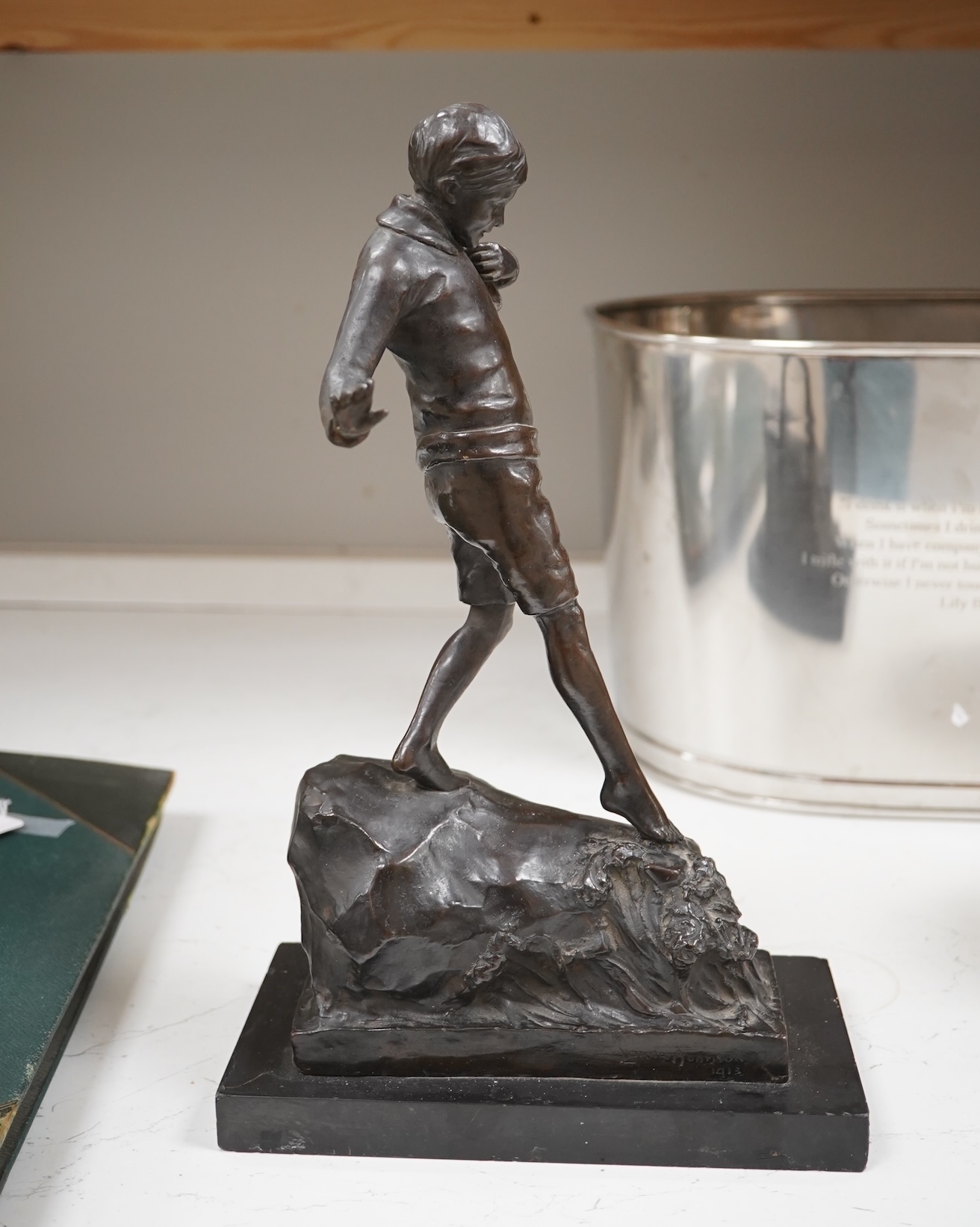 Lorna Adamson (British b.1894-?), an early 20th century bronze figure of a boy, signed and dated 1913, on marble base, 36cm. Condition - nibbles to base, otherwise good